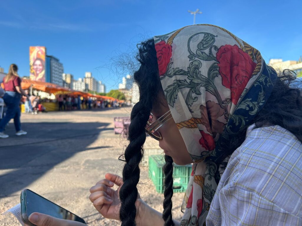 me at a fair in my neighbourhood waiting to eat some fried goods